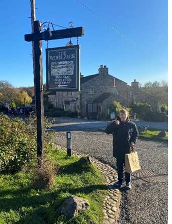 Young Person With Woolpack Sign